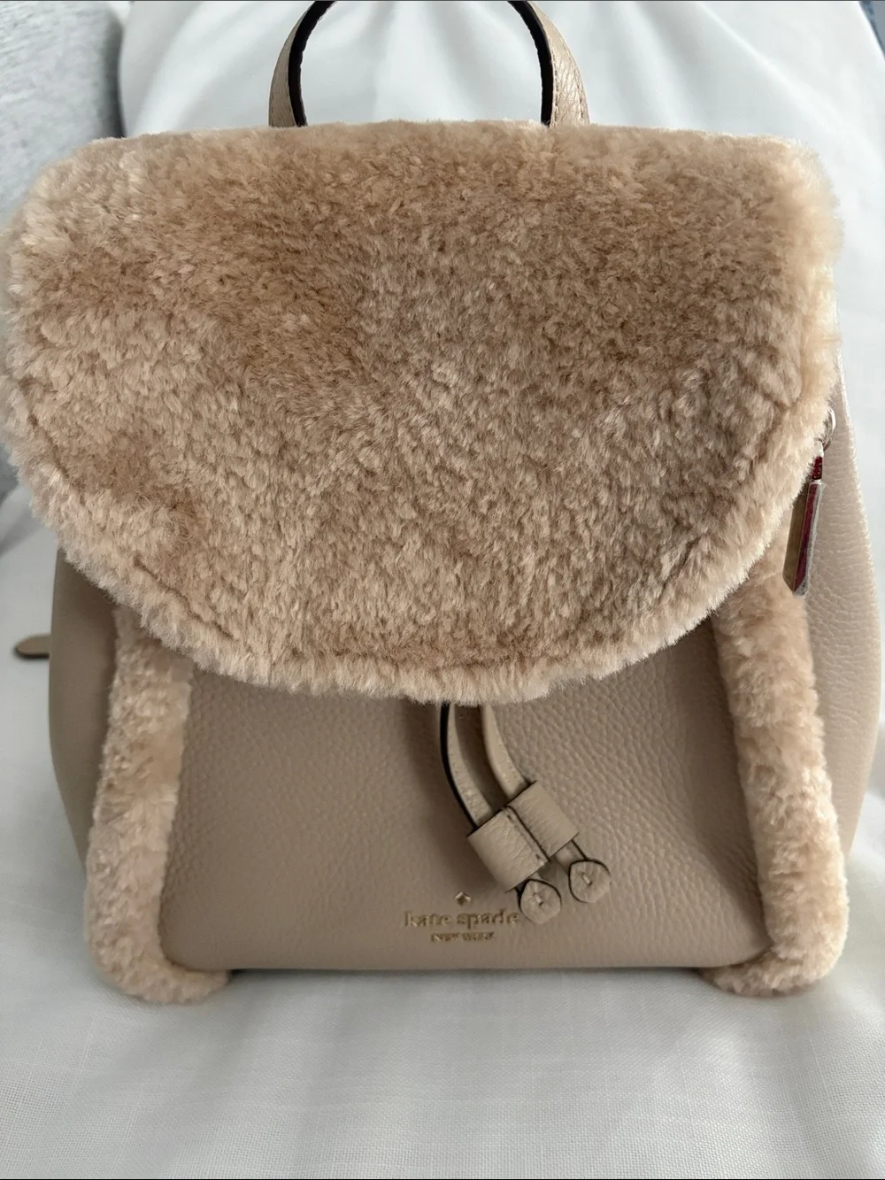 kate spade beige faux-shearling flap backpack